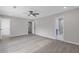 Large bedroom with ceiling fan, hardwood flooring and bathroom entrance at 285 Camden Park Dr, Lawrenceville, GA 30046