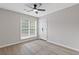 Bedroom with hardwood flooring, ceiling fan, and a window with blinds at 285 Camden Park Dr, Lawrenceville, GA 30046
