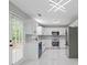 Bright kitchen with white cabinets, stainless steel appliances, and sleek countertops with tiled backsplash at 285 Camden Park Dr, Lawrenceville, GA 30046