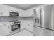 Bright kitchen with stainless steel appliances and white cabinets at 285 Camden Park Dr, Lawrenceville, GA 30046
