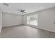 Spacious living room with hardwood flooring, neutral walls, and ceiling fan at 285 Camden Park Dr, Lawrenceville, GA 30046