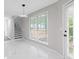 Bright living room featuring large windows and a modern lighting fixture at 285 Camden Park Dr, Lawrenceville, GA 30046