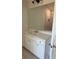 This bathroom vanity features white cabinets, light countertop, and large mirror at 3036 Zodiac Ct, Lawrenceville, GA 30044