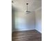 Cozy dining room features hardwood floors, neutral walls, modern lighting, and elegant trim at 3036 Zodiac Ct, Lawrenceville, GA 30044