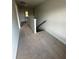 A long carpeted hallway with neutral walls and white trim and baseboards at 3036 Zodiac Ct, Lawrenceville, GA 30044