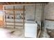 Laundry area with washer hookups and shelving for easy storage at 3560 Emily Way, Atlanta, GA 30349