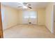 This bedroom boasts natural light, a ceiling fan, and ample space for relaxation and rest at 3560 Emily Way, Atlanta, GA 30349