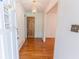 Inviting foyer with gleaming hardwood floors and elegant chandelier lighting at 3560 Emily Way, Atlanta, GA 30349