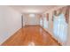 Spacious living room with hardwood floors, natural light, and a chandelier at 3560 Emily Way, Atlanta, GA 30349