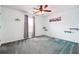Bedroom with light blue walls and ceiling fan, with shelves and city artwork on the walls at 3715 Frankie Wade Ln, Loganville, GA 30052
