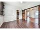 Open dining area featuring dark wood floors and barn door access to the living room at 3715 Frankie Wade Ln, Loganville, GA 30052