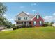 Charming home featuring a large, well-maintained front lawn and blue shutters at 3715 Frankie Wade Ln, Loganville, GA 30052