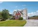 Two-story home with brick and siding, plus a long driveway leading to a garage at 3715 Frankie Wade Ln, Loganville, GA 30052