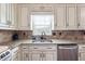 The kitchen boasts stone backsplash, stainless steel appliances, and granite countertops at 3715 Frankie Wade Ln, Loganville, GA 30052