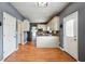 Spacious kitchen that features stainless steel appliances, wooden floors, and modern cabinets at 3715 Frankie Wade Ln, Loganville, GA 30052