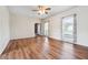 Bright living room featuring wood floors, neutral paint, and natural light at 3715 Frankie Wade Ln, Loganville, GA 30052