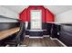Red and black themed office space with a window and modern decor at 3715 Frankie Wade Ln, Loganville, GA 30052