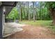 Scenic backyard featuring a patio, mature trees, and lush greenery at 140 Larose Se Cir, Marietta, GA 30060