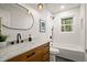 Stylish bathroom with marble countertops, modern fixtures, and a bathtub at 140 Larose Se Cir, Marietta, GA 30060