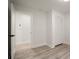 Bedroom with light-colored wood floors, white walls and trim, and a closet for storage at 140 Larose Se Cir, Marietta, GA 30060