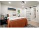 Inviting bedroom with a warm color palette and ample natural light at 140 Larose Se Cir, Marietta, GA 30060