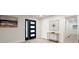 Modern entryway with decorative wall art, console table, and stylish front door with sidelight at 140 Larose Se Cir, Marietta, GA 30060