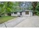 Beautifully landscaped home featuring modern exterior, and a spacious driveway at 140 Larose Se Cir, Marietta, GA 30060