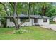 Charming renovated ranch home with a painted brick facade, dark trim and new front door at 140 Larose Se Cir, Marietta, GA 30060