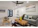 Bright living room features modern decor, a ceiling fan, and new wood-look flooring at 140 Larose Se Cir, Marietta, GA 30060