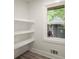 Well-lit pantry with ample shelving for organized storage and convenience at 140 Larose Se Cir, Marietta, GA 30060