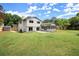 Expansive backyard featuring a lush lawn, mature trees, and a charming shed at 1863 Trumbull Dr, Atlanta, GA 30338