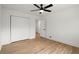 Clean bedroom featuring hardwood floors, a ceiling fan, closet and neutral color palette at 1863 Trumbull Dr, Atlanta, GA 30338
