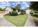Beautifully landscaped exterior with a well-maintained lawn and concrete walkway at 1863 Trumbull Dr, Atlanta, GA 30338