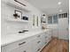Stylish kitchen with white cabinets, quartz countertops, and stainless steel appliances at 1863 Trumbull Dr, Atlanta, GA 30338