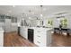 Bright kitchen featuring a large center island, sleek countertops, and stainless steel appliances at 1863 Trumbull Dr, Atlanta, GA 30338