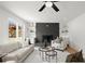 Comfortable living room featuring a brick fireplace, built-in shelves, and large windows with views of the yard at 1863 Trumbull Dr, Atlanta, GA 30338
