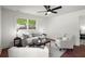 Inviting living room featuring hardwood floors, neutral tones, and large windows at 1863 Trumbull Dr, Atlanta, GA 30338