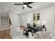 Cozy living room with stylish furniture, a ceiling fan, and natural light, offering a welcoming atmosphere at 1863 Trumbull Dr, Atlanta, GA 30338