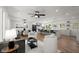 Bright, open-concept living room with hardwood floors, a modern kitchen, and stylish furniture at 1863 Trumbull Dr, Atlanta, GA 30338