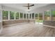 Spacious sunroom with brick accents, laminate flooring, and lots of natural light at 1863 Trumbull Dr, Atlanta, GA 30338