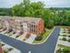 Aerial view of townhomes with landscaped lawns on a well-manicured street at 4888 Colchester Se Ct # 3, Atlanta, GA 30080