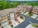 Aerial view of townhomes with well-maintained front yards and a lush green neighborhood at 4888 Colchester Se Ct # 3, Atlanta, GA 30080