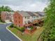 Aerial view of townhome backyards with private patios, wooden fences, and well-maintained lawns at 4888 Colchester Se Ct # 3, Atlanta, GA 30080