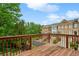 Relaxing wooden balcony overlooking landscaped grounds and multi-story brick residences at 4888 Colchester Se Ct # 3, Atlanta, GA 30080