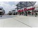 View of the Atlanta Braves signage and surrounding commercial buildings with modern architecture and pedestrian walkways at 4888 Colchester Se Ct # 3, Atlanta, GA 30080