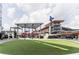 Outdoor green space facing commercial buildings and restaurants, part of the Atlanta Braves stadium and shopping complex at 4888 Colchester Se Ct # 3, Atlanta, GA 30080