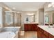 Luxurious main bathroom with a soaking tub, glass-enclosed shower, and double vanity with granite counters at 4888 Colchester Se Ct # 3, Atlanta, GA 30080