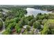 Aerial view of neighborhood with lake at 520 Flying Scot Way, Alpharetta, GA 30005