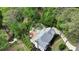 Aerial view of private backyard oasis featuring a custom pool, meticulous landscaping, and waterfront access at 520 Flying Scot Way, Alpharetta, GA 30005