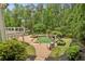 View of the inground pool and deck from the backyard at 520 Flying Scot Way, Alpharetta, GA 30005